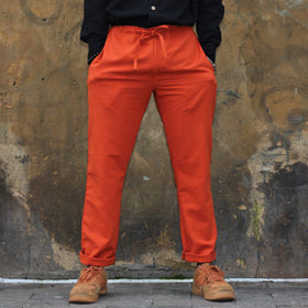 Unisex Ribbed Cotton Shing Mai Trousers Orange front, on model