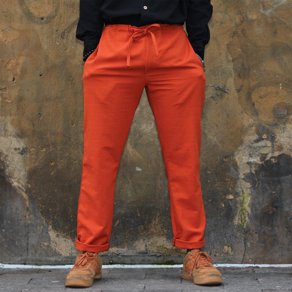 Unisex Ribbed Cotton Shing Mai Trousers Orange front, on model