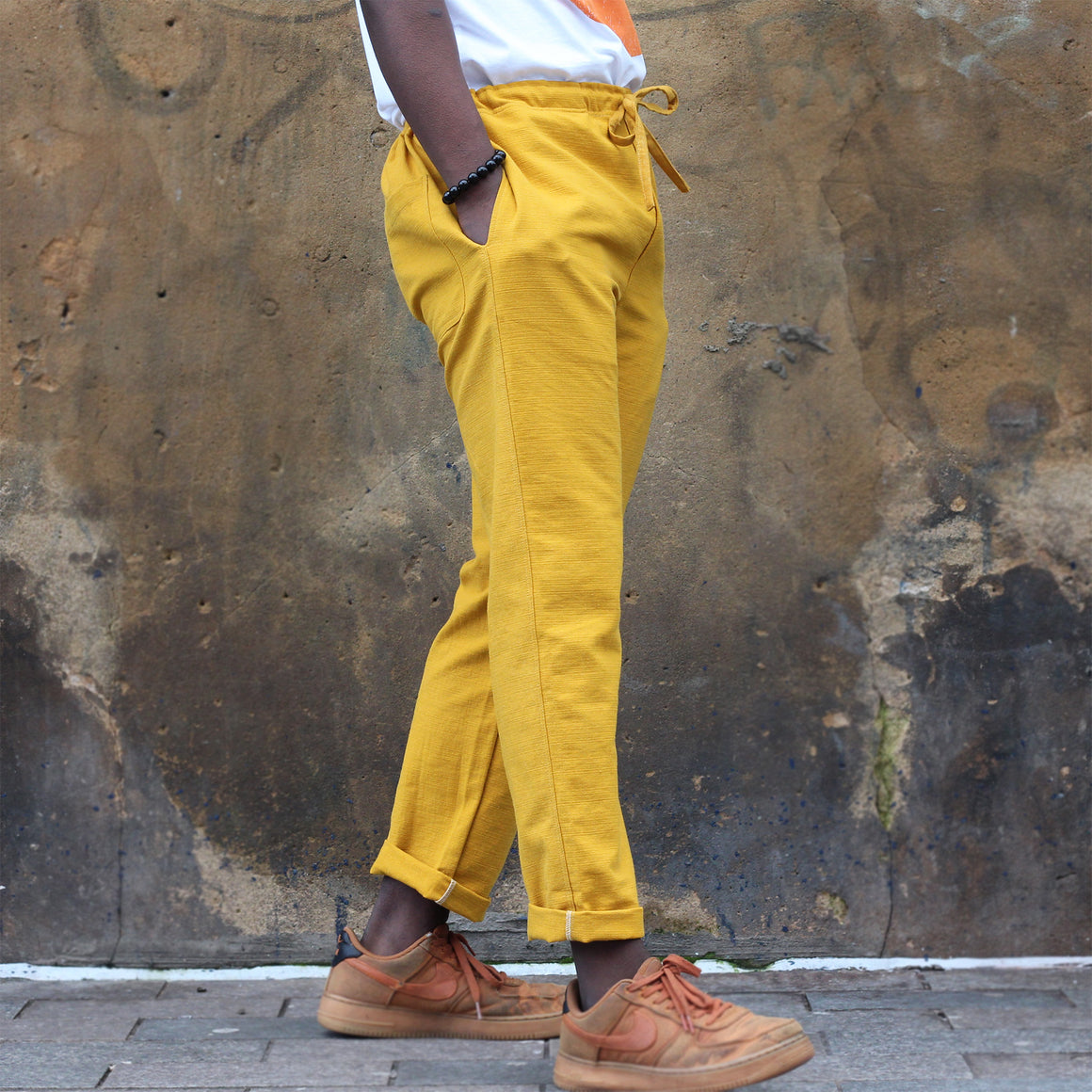 Unisex Ribbed Cotton Shing Mai Trousers Yellow front, on model