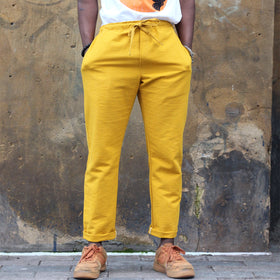 Unisex Ribbed Cotton Shing Mai Trousers Yellow front, on model