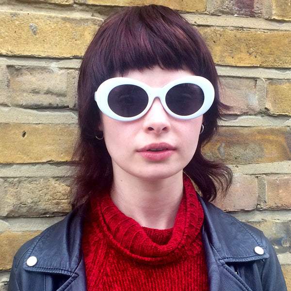 White Kurt Cobain sunglasses worn by Maisie