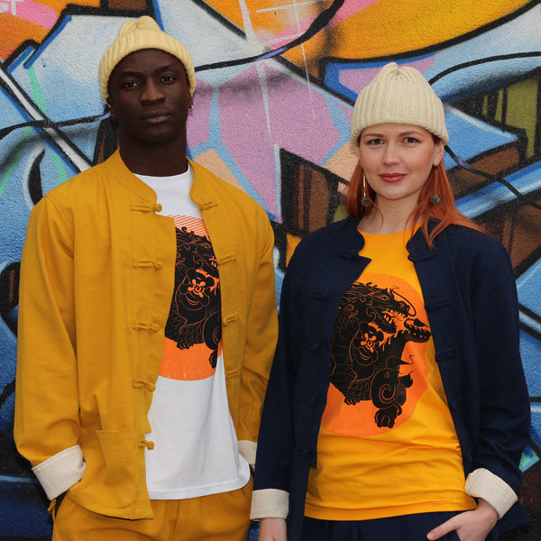 Unisex yellow and navy blue ribbed cotton mandarin jackets and shing mai trousers sets with Thunder Dragon T-shirts